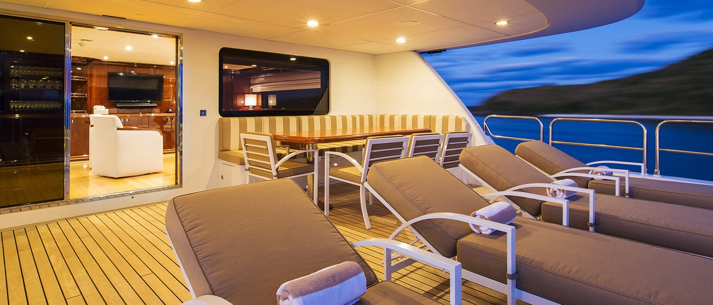 Aft deck sun-lounges on Luxury boat hire Whitsundays