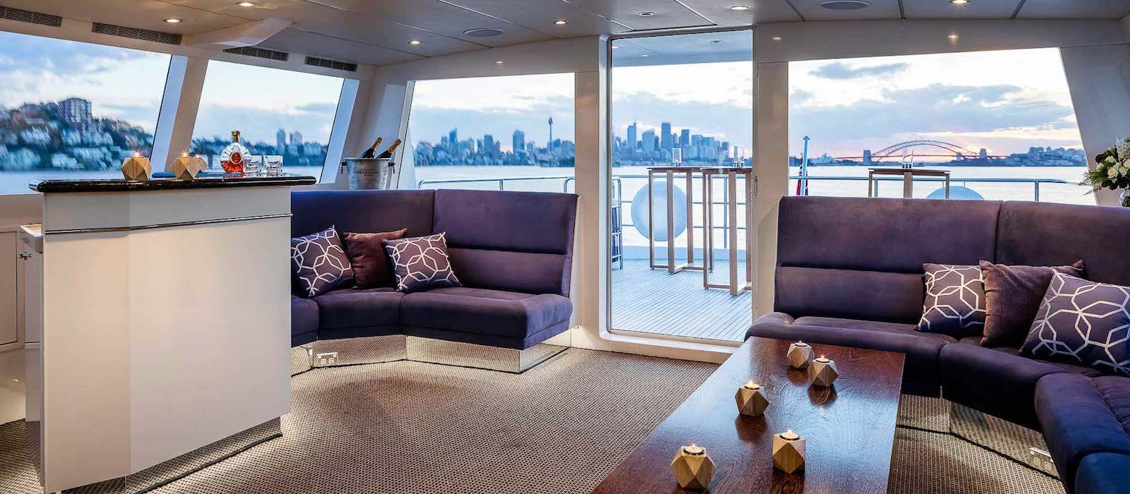 Aft deck lounge on AQA luxury boat hire