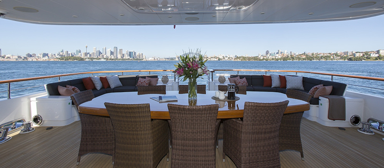 Aft deck dining on Masteka II luxury boat hire