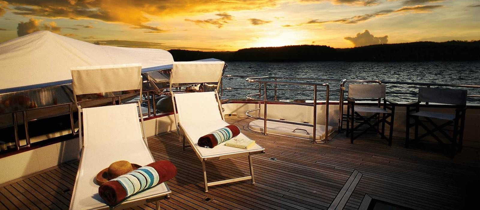 Sun setting on Galaxy I luxury boat hire Whitsundays