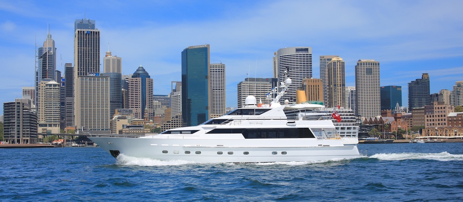 Oscar II luxury boat hire with cityscape background