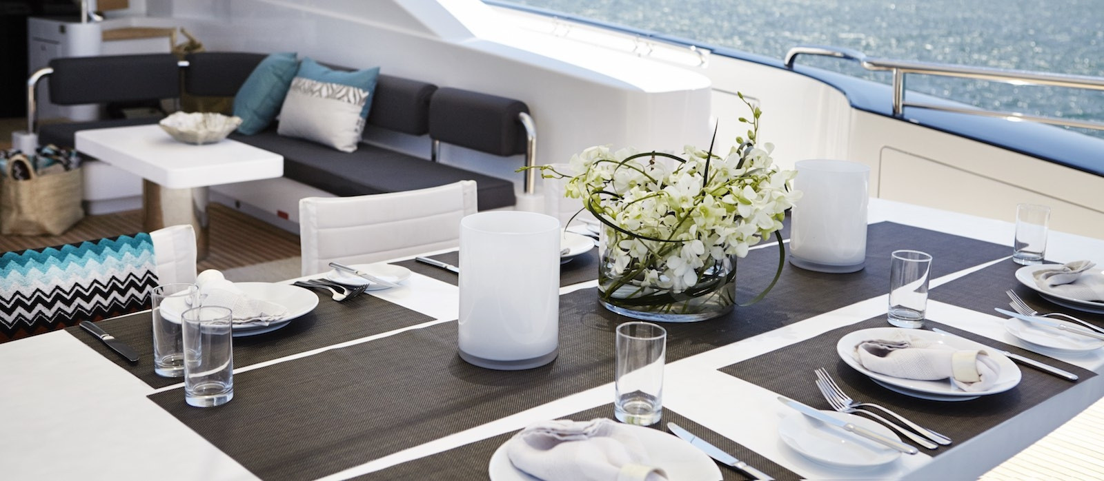 Dining and lounge on aft deck of Quantum super yacht hire
