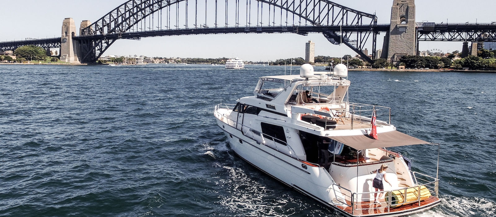 Enigma luxury boat hire approaching Harbour Bridge