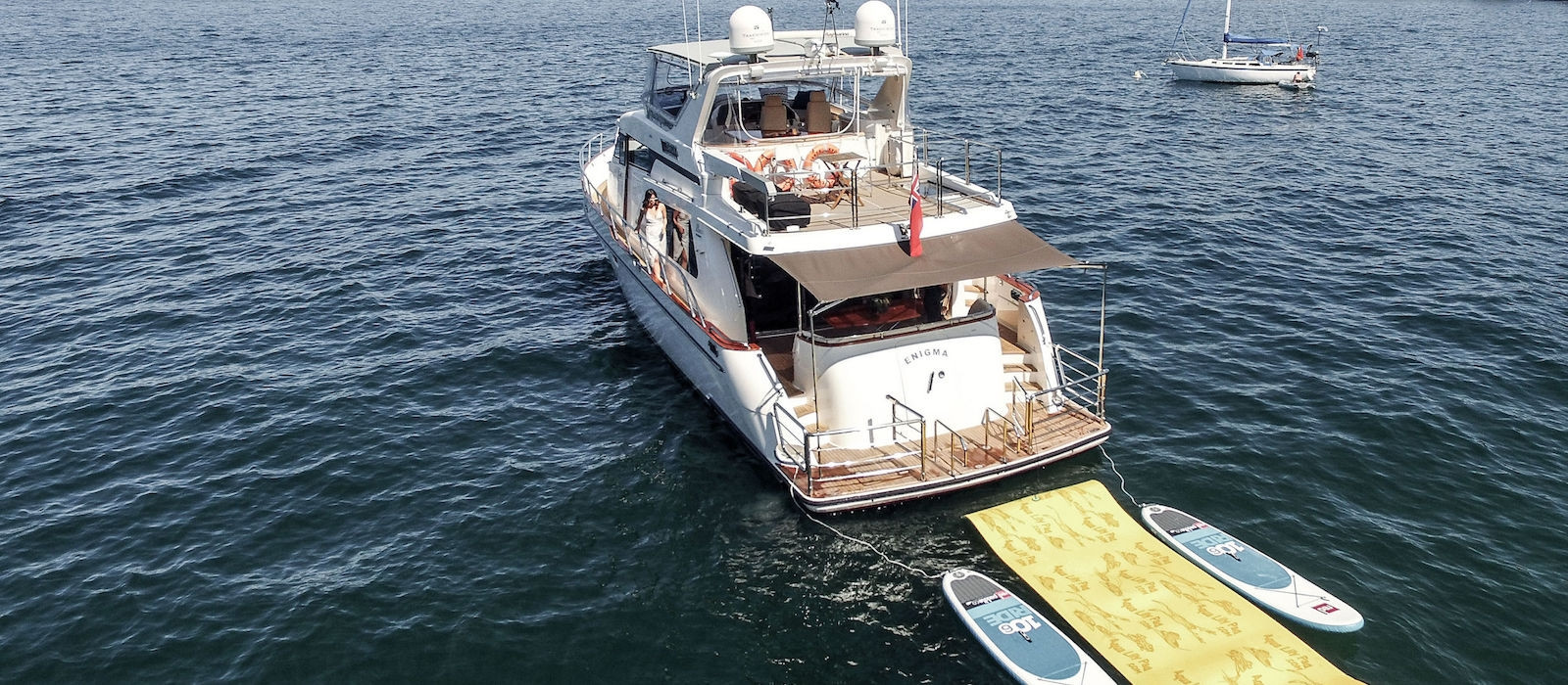 Rear view of Enigma luxury boat hire with toys