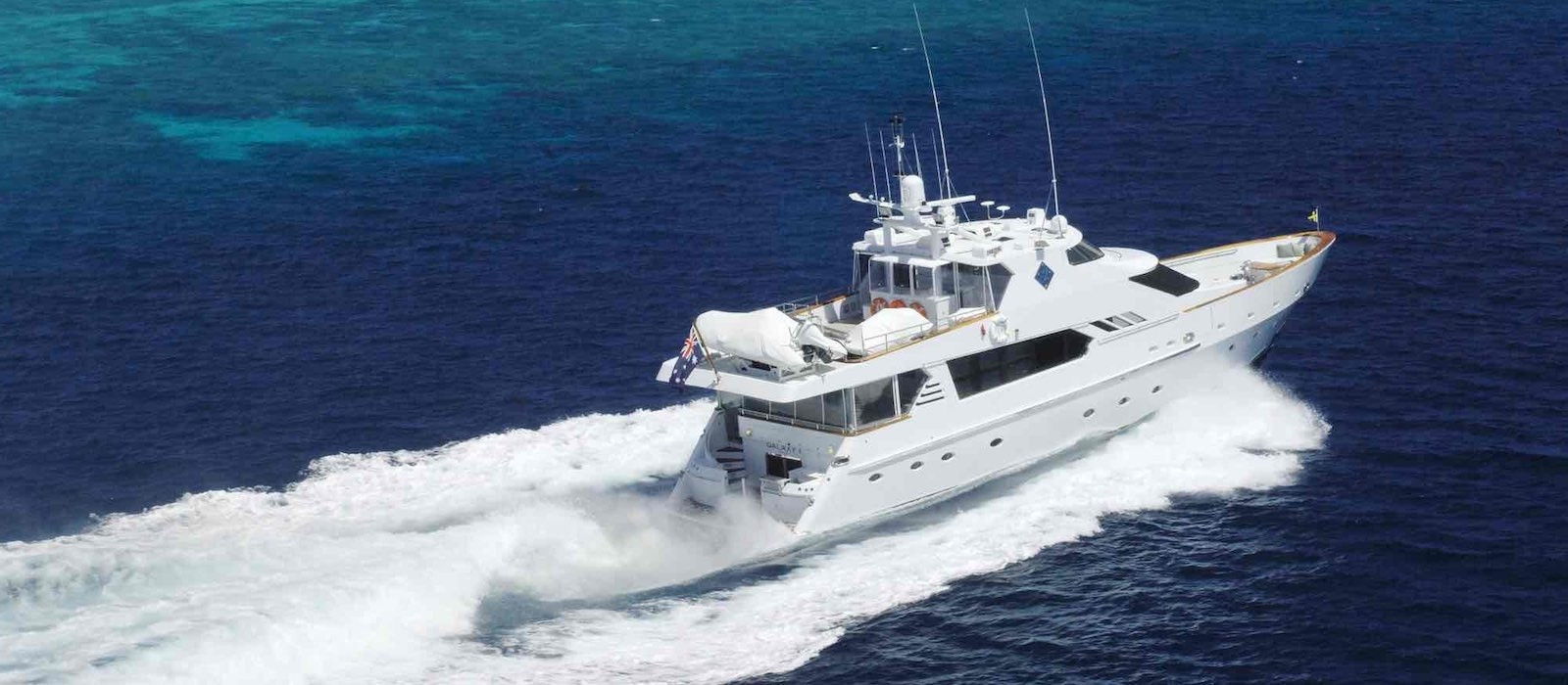 Aerial stern view of Galaxy I luxury boat hire Whitsundays