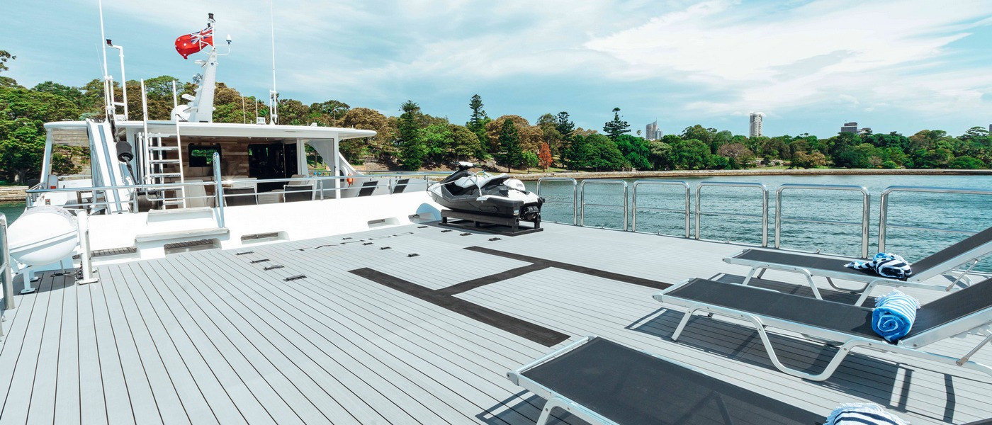 Luxury boat hire on Tango top deck helipad 