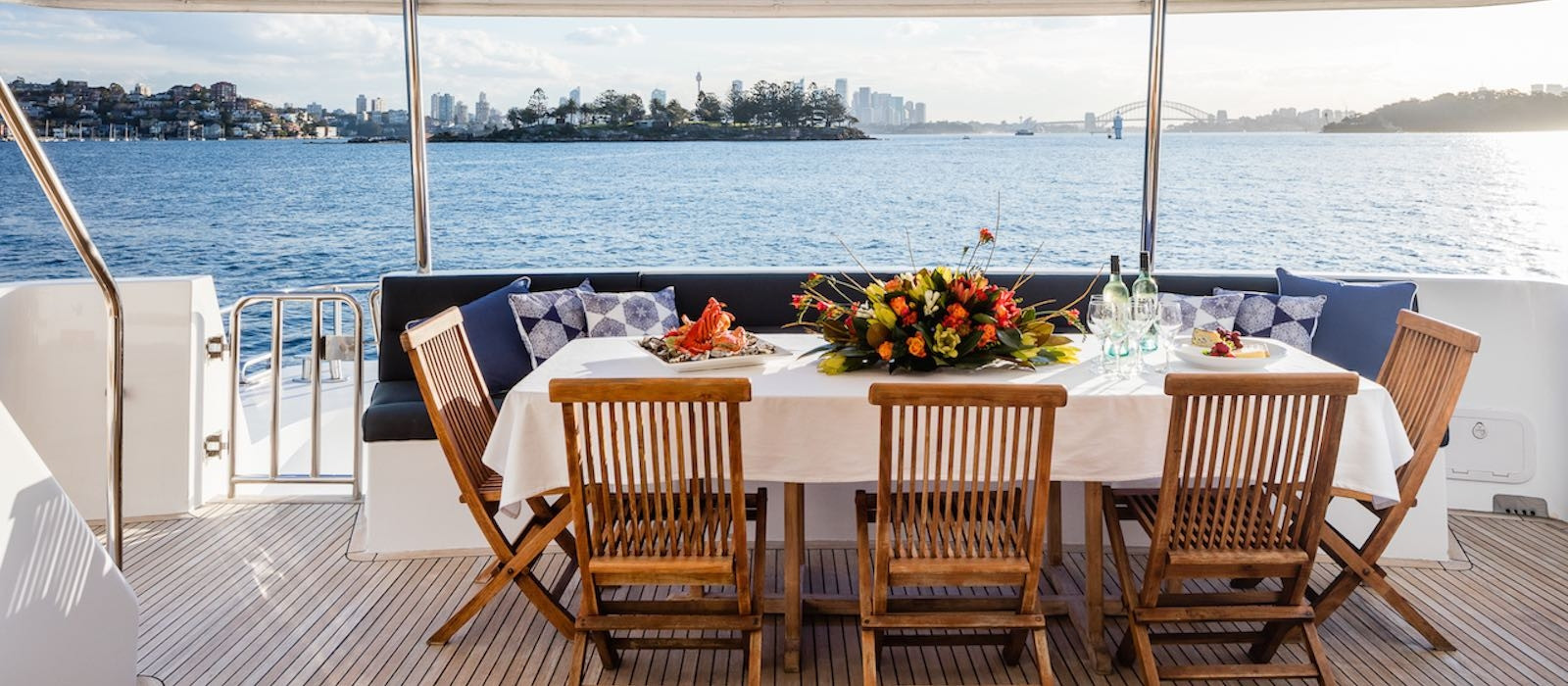 Dining on aft deck of AQA luxury boat hire