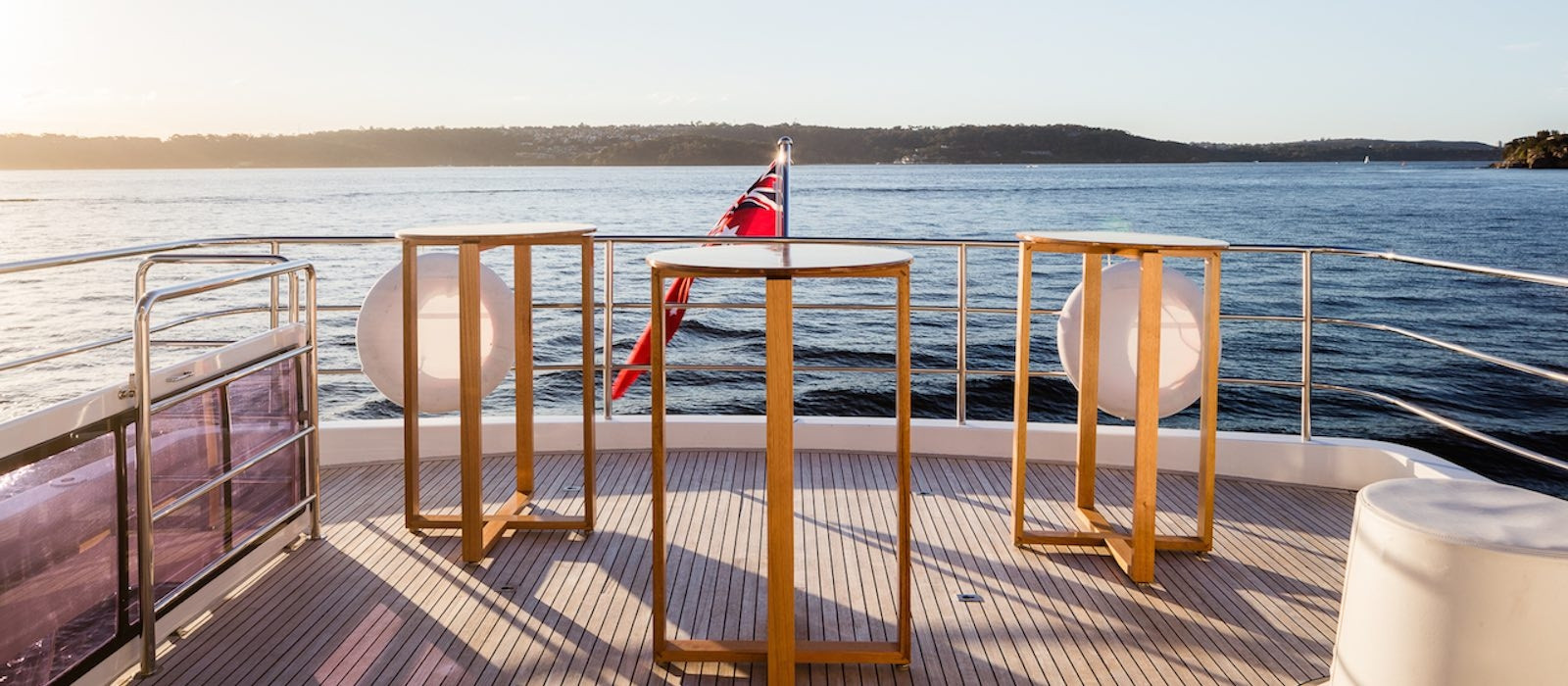 Sun setting on open aft deck of AQA luxury boat hire