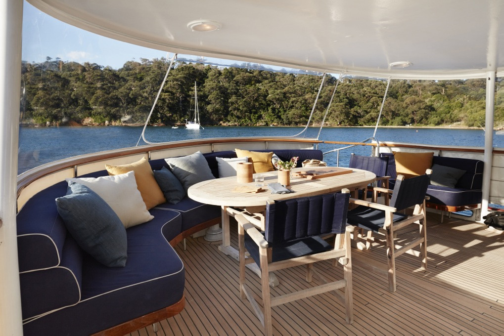 Sunny outdoor deck on luxury boat hire on Hillani