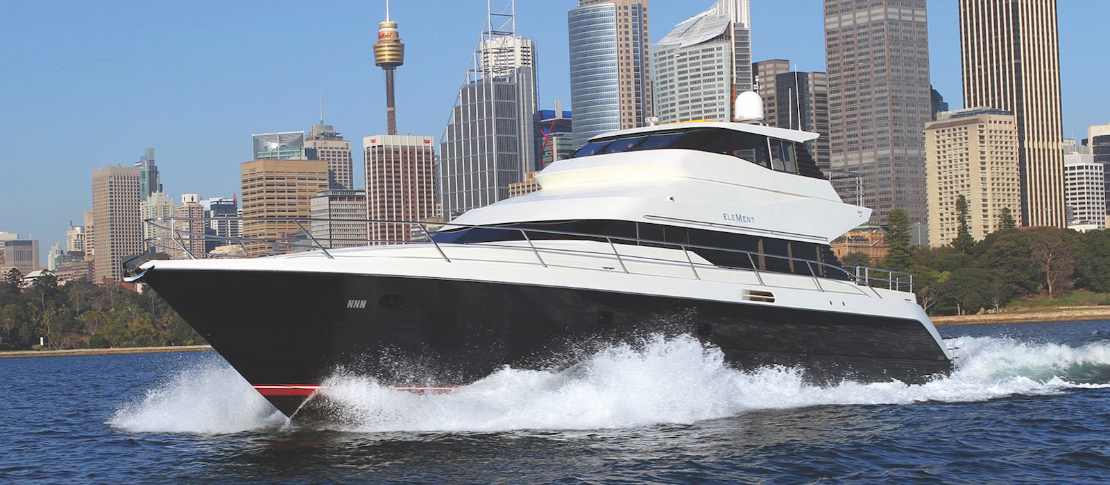 Element luxury boat hire cruising with Sydney cityscape background