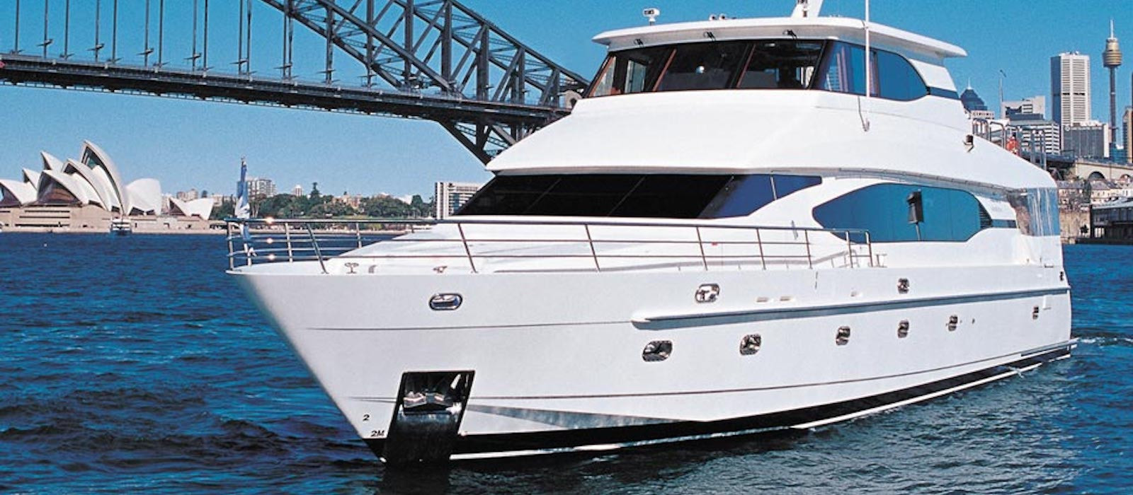 Oceanos luxury boat hire with Harbour Bridge background