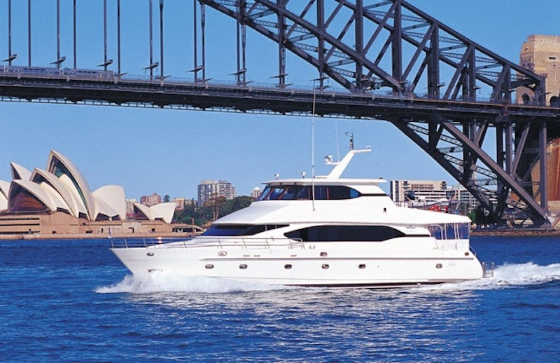 Oceanos luxury boat hire passing the Harbour bridge