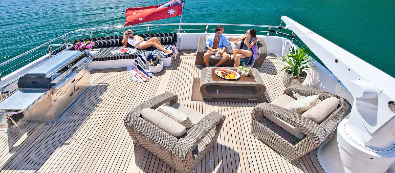 Aft deck lounges on Oscar II superyacht hire