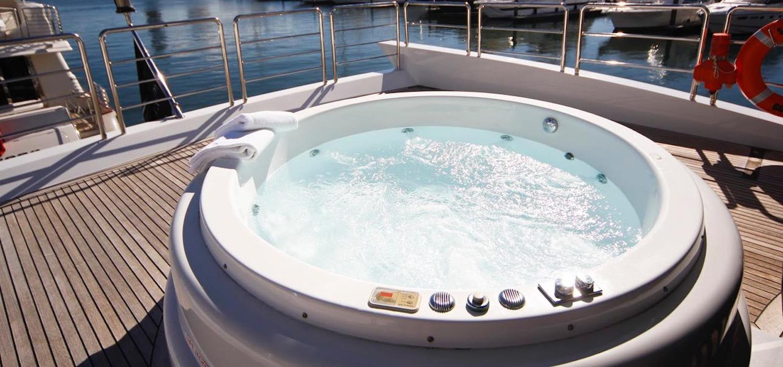 Jacuzzi on sunny day on superyacht hire on Seven Star